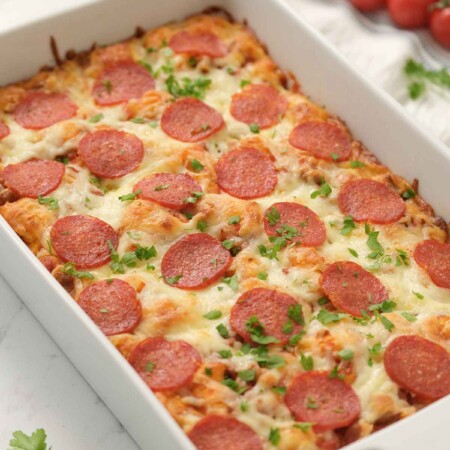 bubble pizza casserole in white baking dish