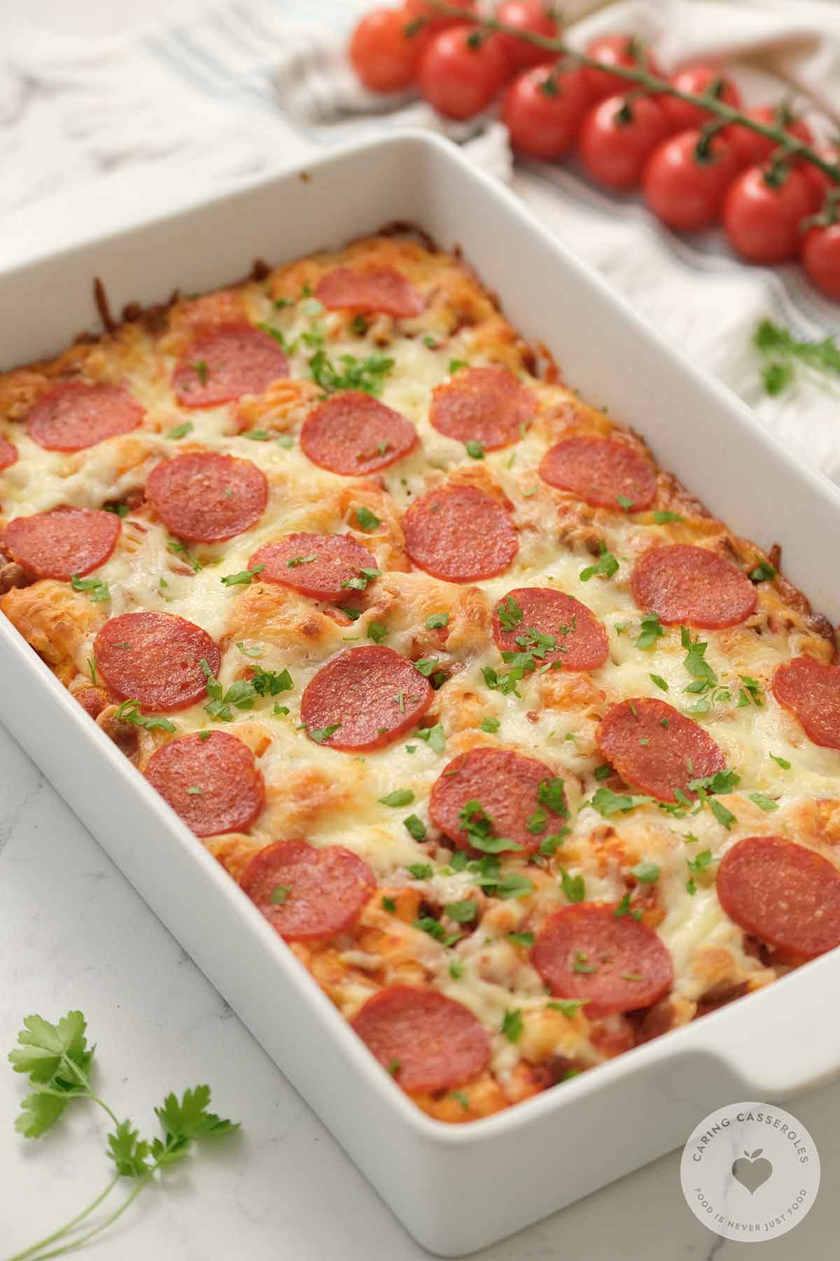 bubble pizza casserole in white baking dish