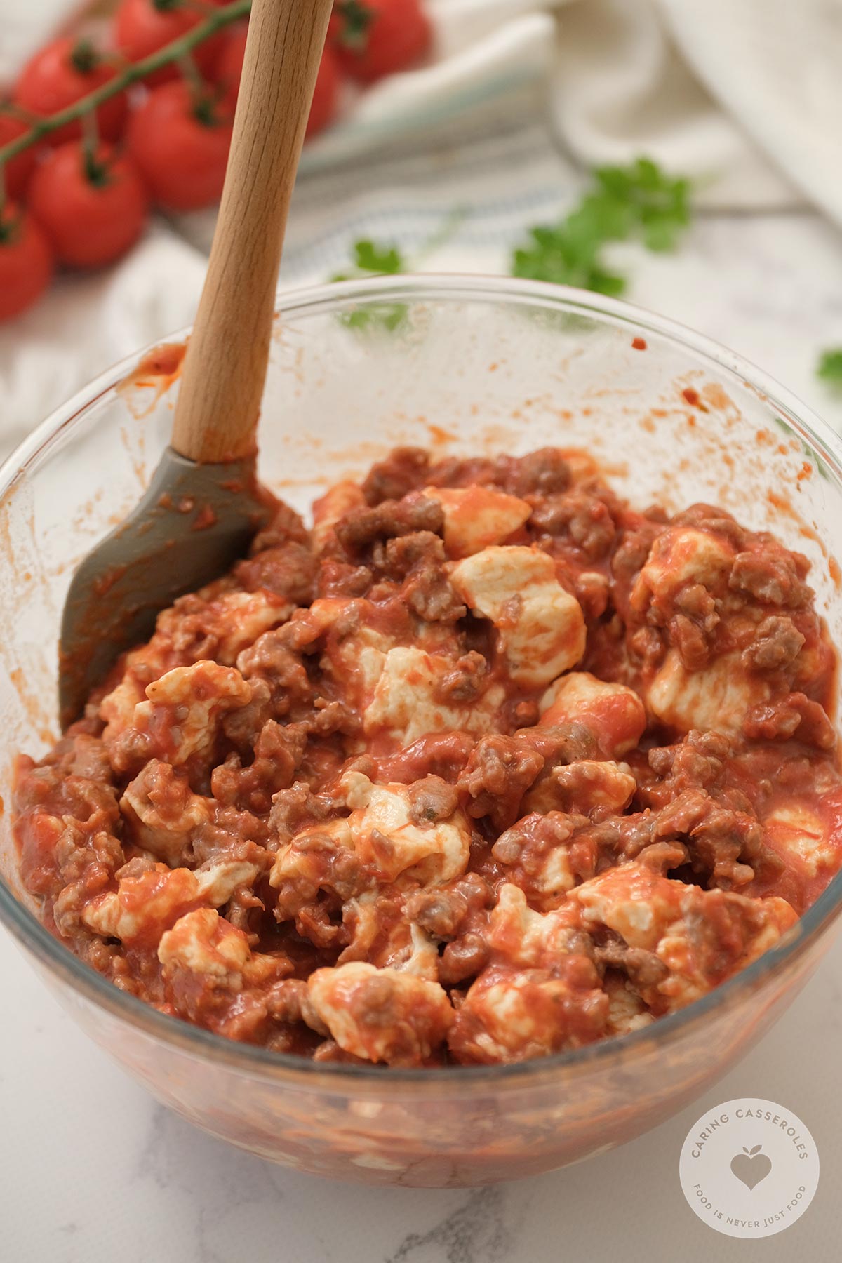 mixing ingredients together in bowl to make bubble pizza