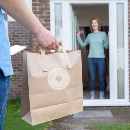 man delivering meal to woman