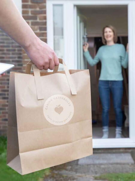 man delivering meal to woman