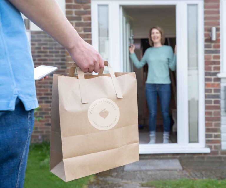 man delivering meal to woman