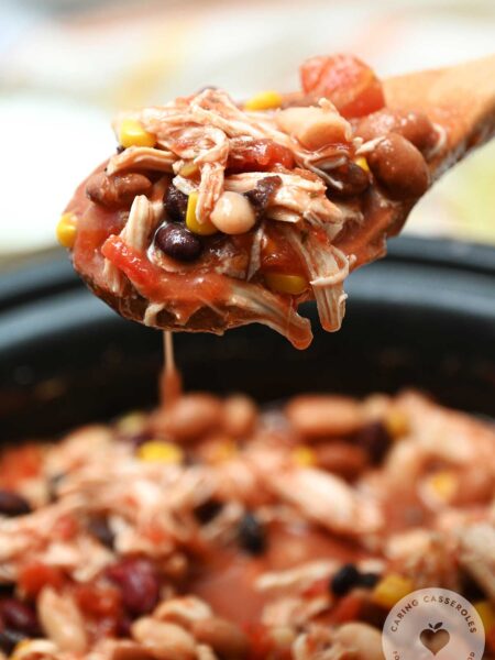 large spoon filled with taco soup from crock pot