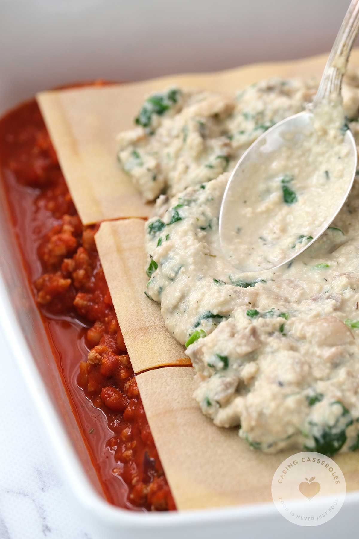 layer lasagna noodles sauce and cashew mixture