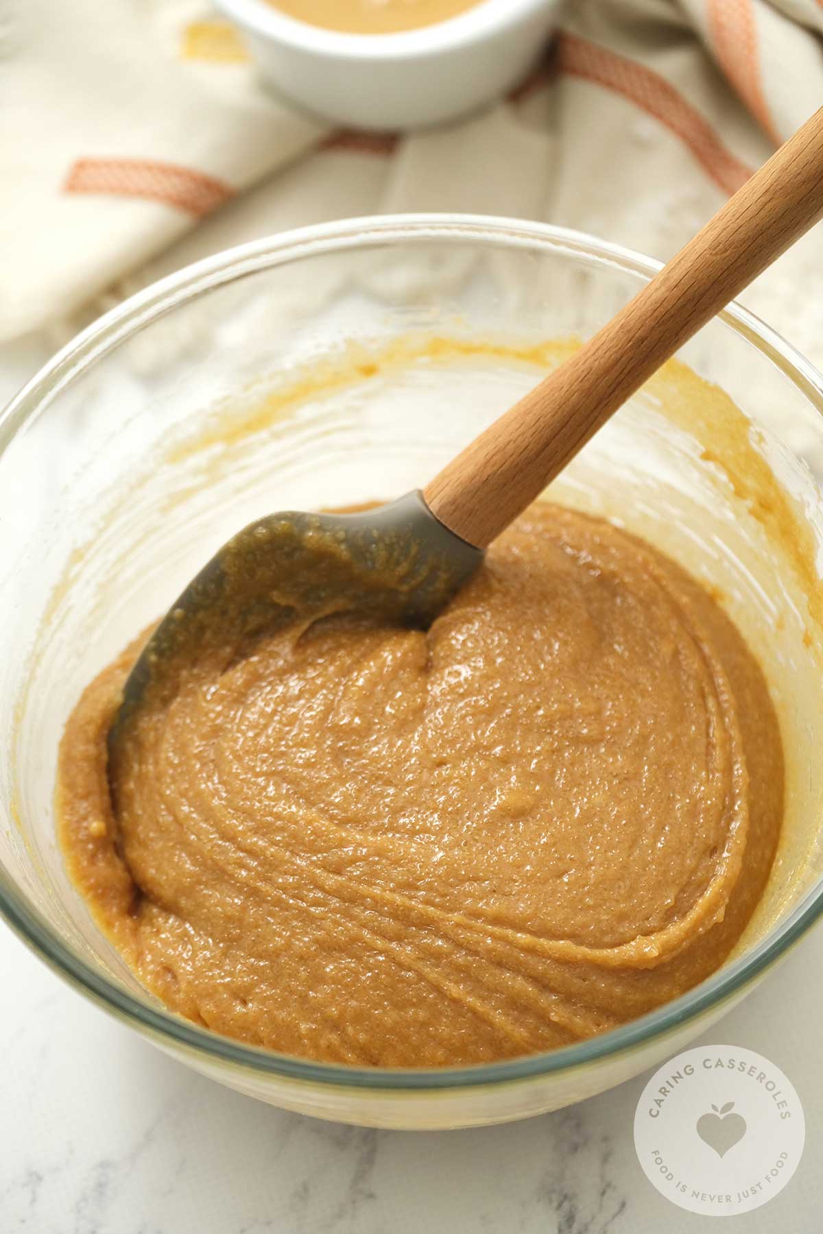 Light brown sugar, peanut butter eggs and vanilla essence whisked together in a bowl.