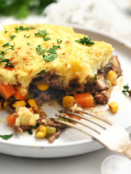 Shephered's Pie served on a white plate made with a recipe from Caring Casseroles.