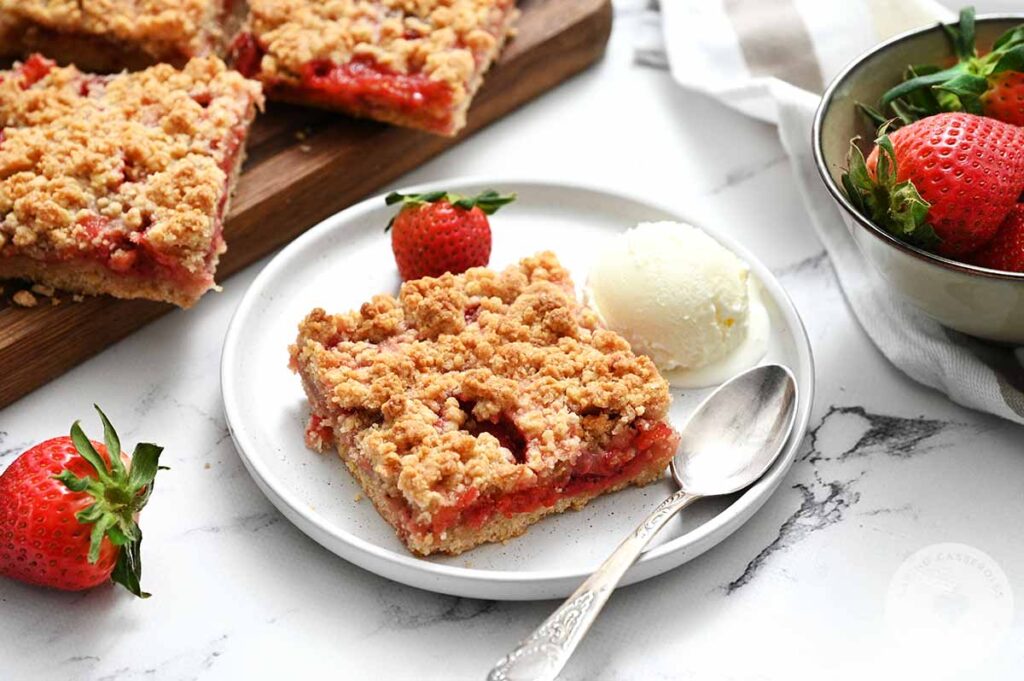 Strawberry Crumb Bars served with ice cream.