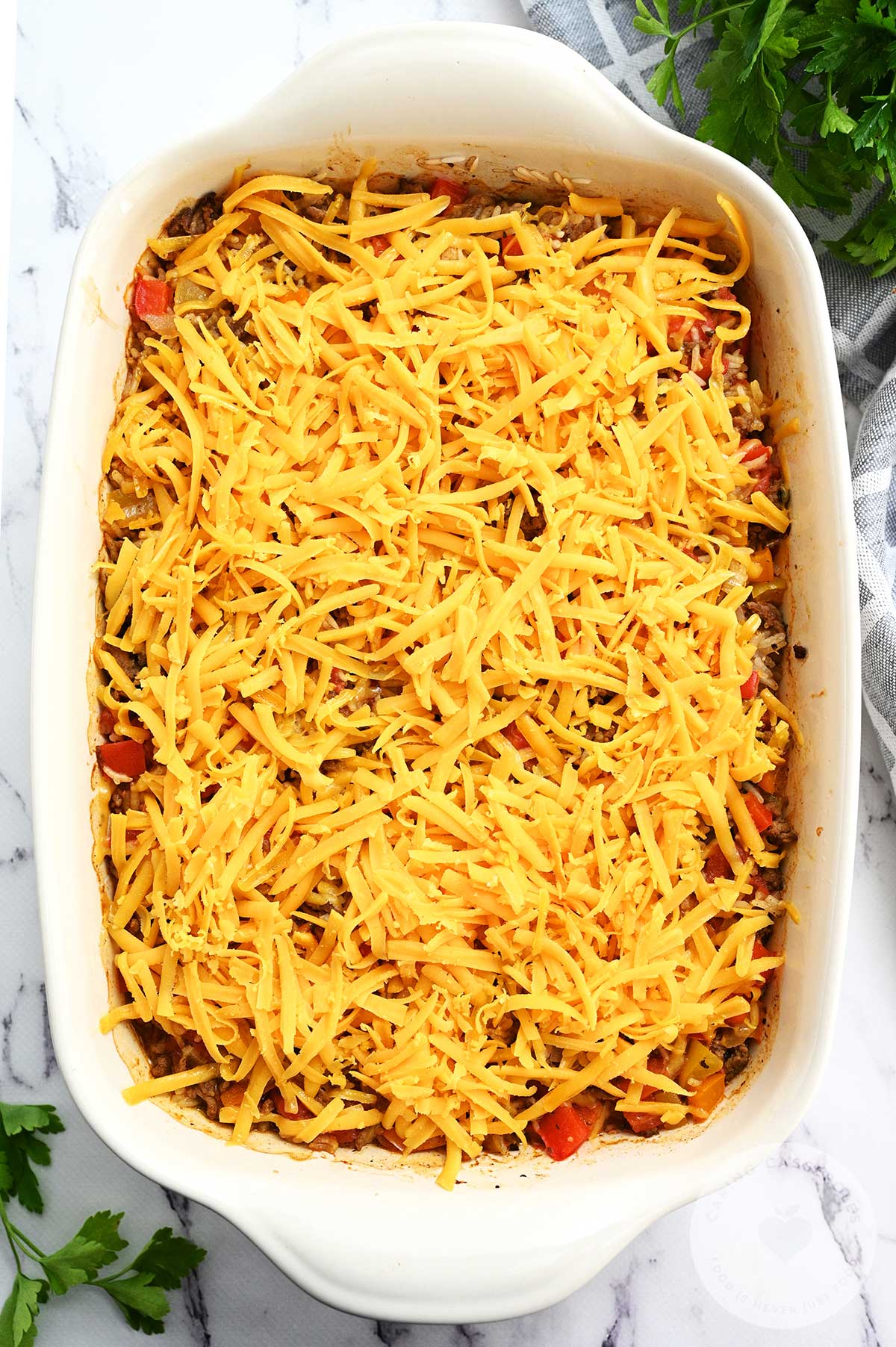 Casserole dish topped with cheese. 