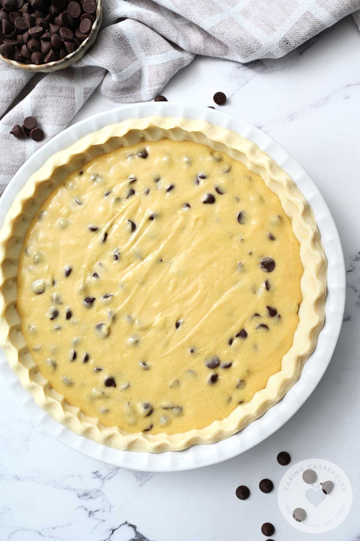 A pie shell with the batter evenly spread throughout. 