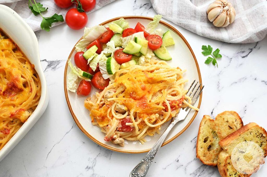 Chicken Spaghetti served on a plate made with a recipe from Caring Casserole.