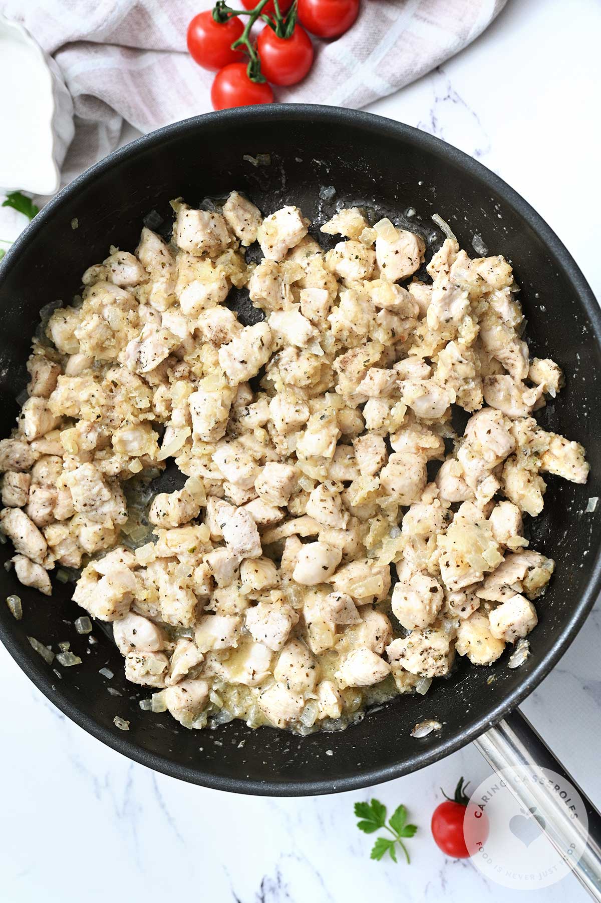 Chicken added to the garlic and onion in the pan.
