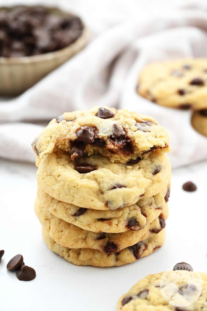 Freshly backed chocolate chip cookies in a tower, baked from a recipe from Caring Casseroles. 